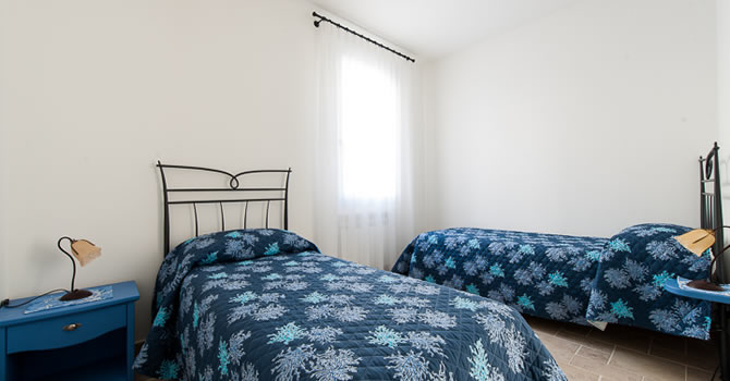 Immagine della camera da letto doppia dell’appartamento Gelsomino